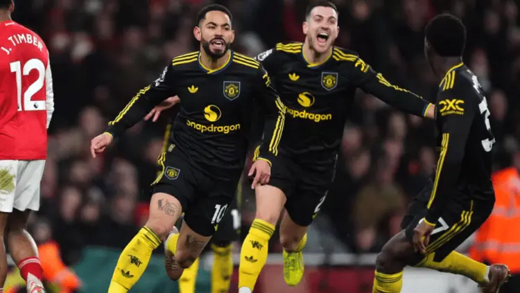 Rekomendasi: Analisis KickIDN: Matheus Cunha merayakan gol kemenangan Manchester United atas Arsenal di Emirates Stadium.